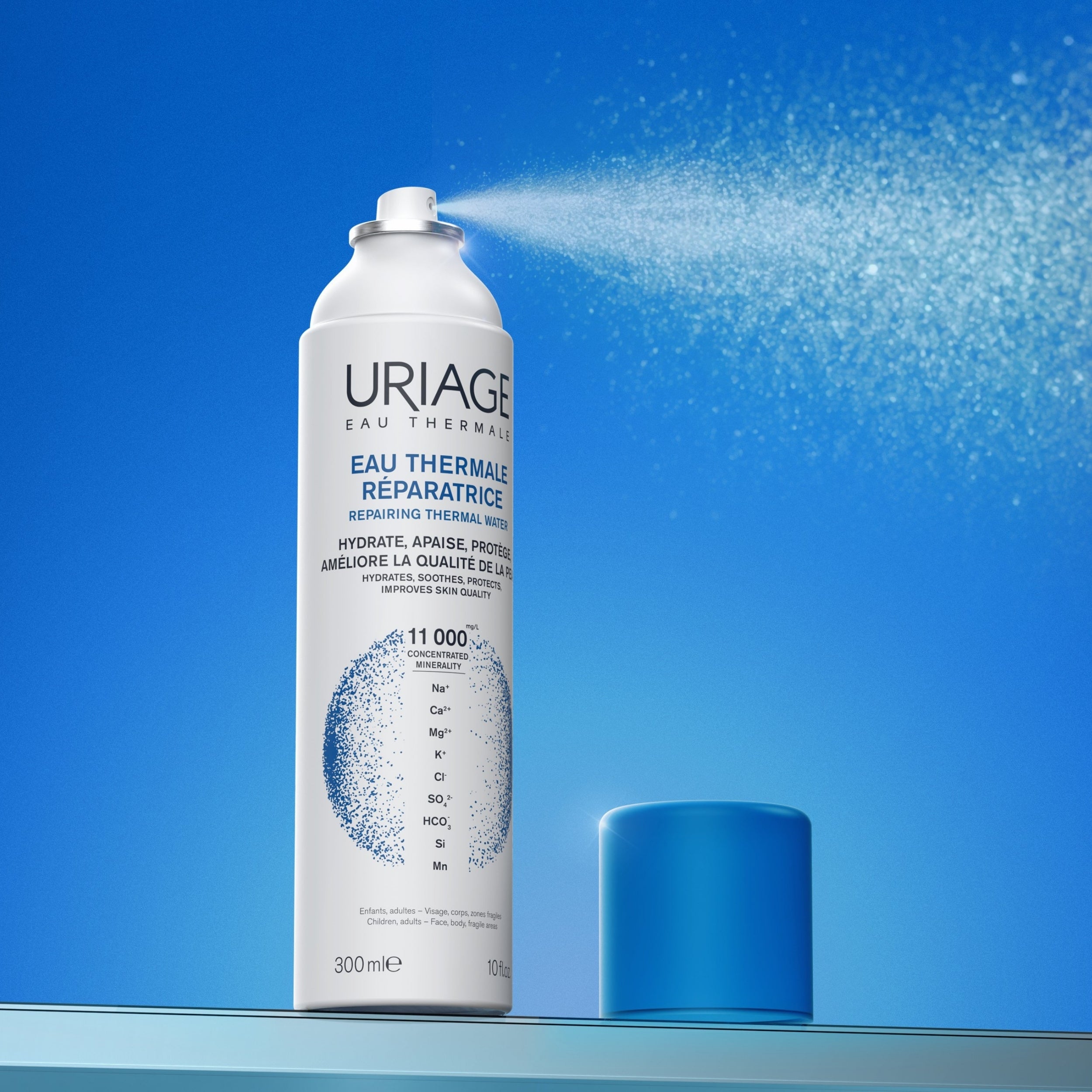 Uriage thermal water spray can on a blue background