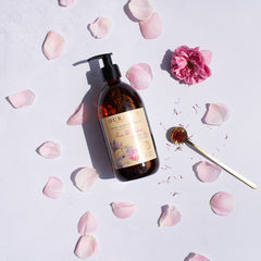 Bottle of Durane soap with floral design on a light background with pink petals