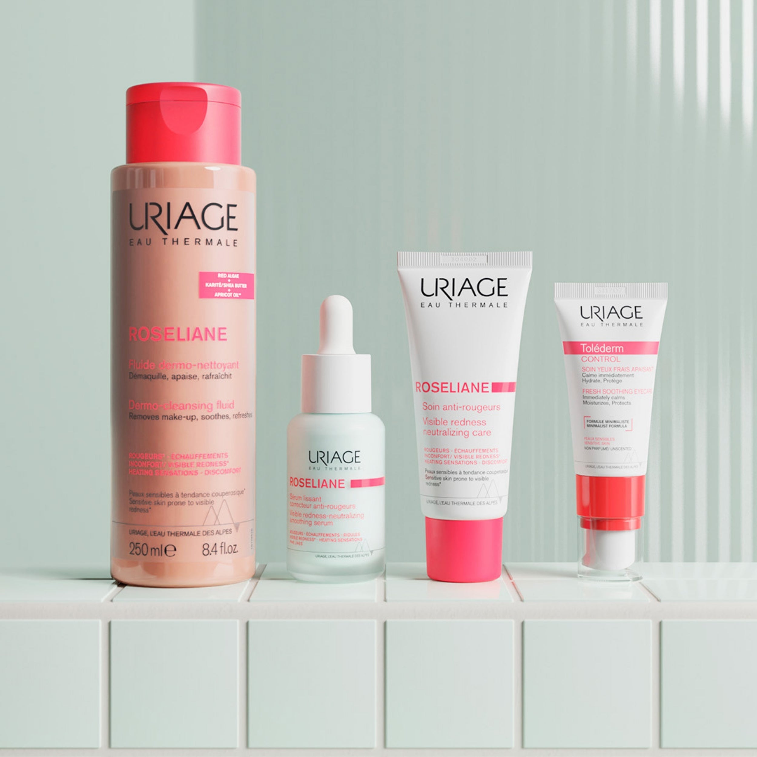 Set of Uriage skincare products on a white surface with a light gray background