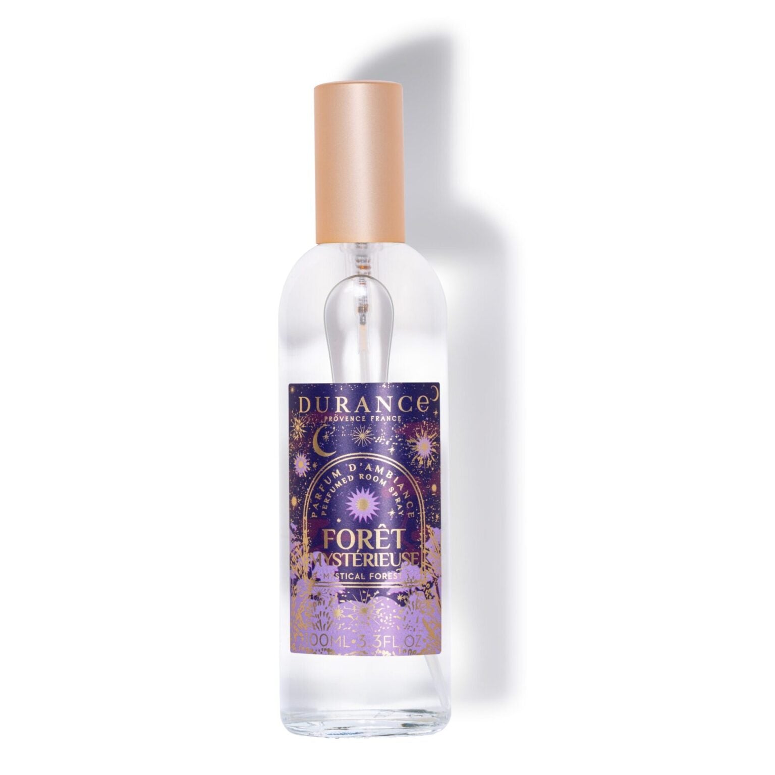 Clear spray bottle with a purple label on a white background