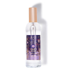 Clear spray bottle with a purple label on a white background