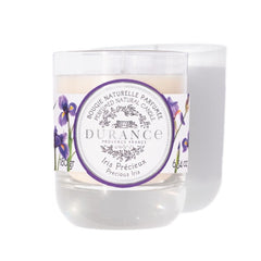 Durance candle with a purple label and floral design on a white background