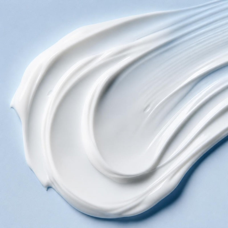 Smooth white sunscreen lotion texture