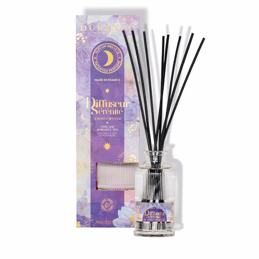 Diffuser with black sticks and purple packaging on a white background