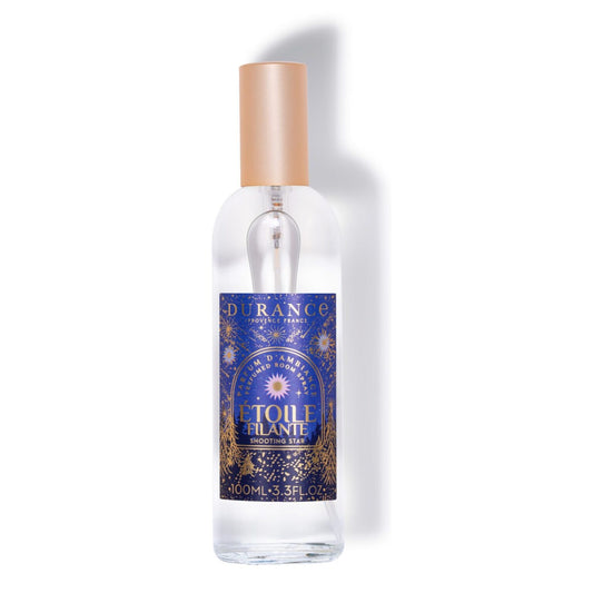 Clear bottle with a gold cap and blue label on a white background