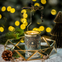 Decorative candle in a geometric holder with a festive background