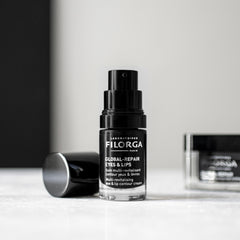 Filorga skincare bottle on a white surface with a neutral background