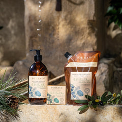 Duranco skincare products on a stone surface with a natural background