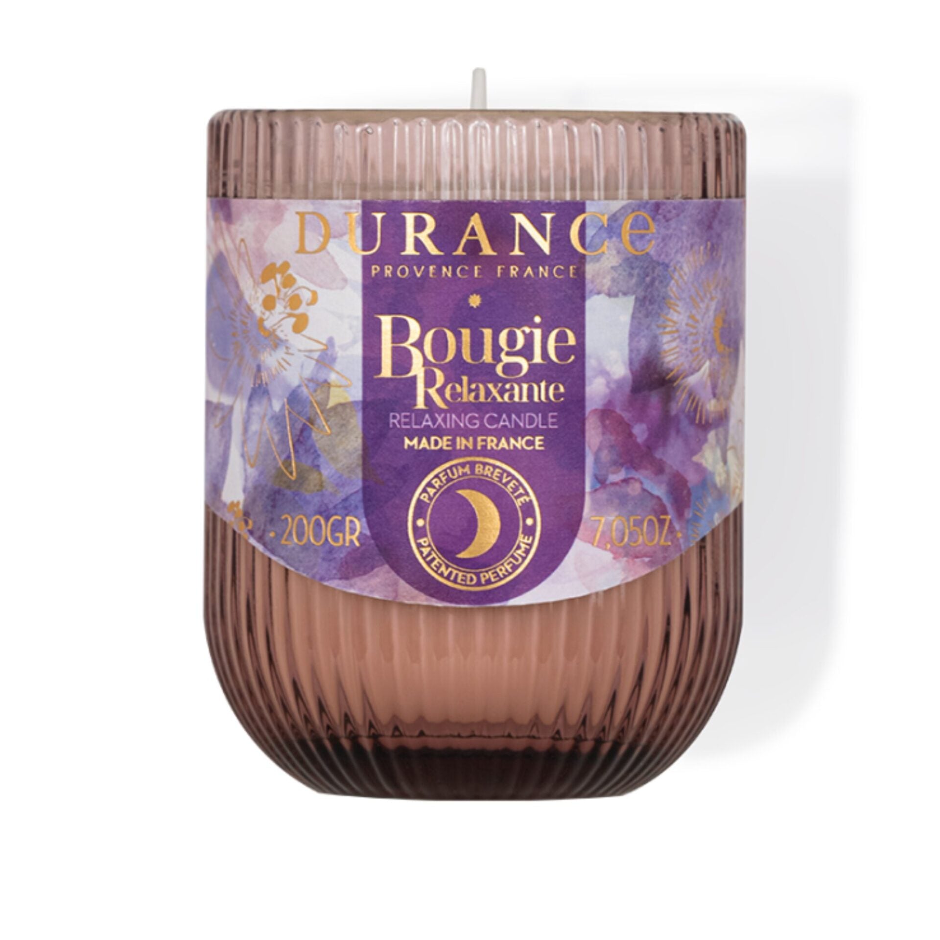 Durance relaxing candle with purple label on a white background
