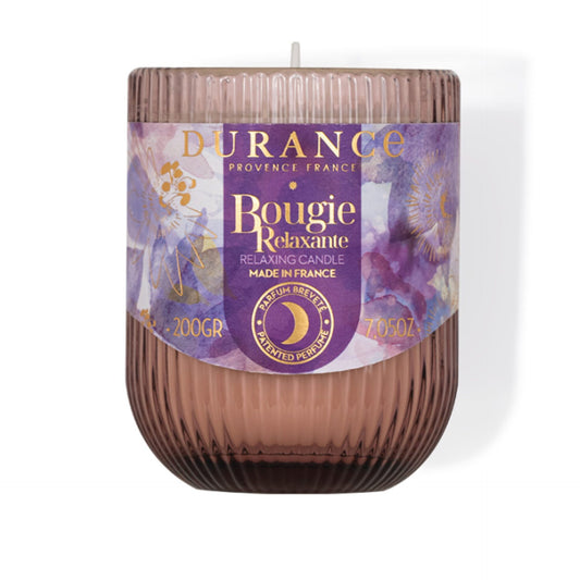Durance relaxing candle with purple label on a white background