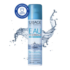 Uriage Eau Thermale bottle with water splashes on a white background