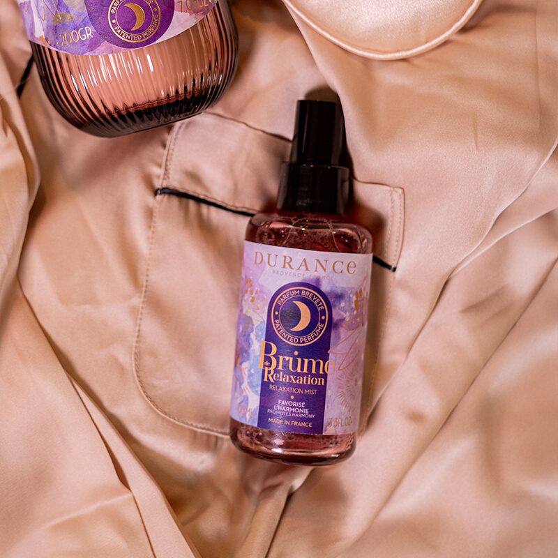 Bottle of DURANCE Brume Relaxation on a beige fabric background