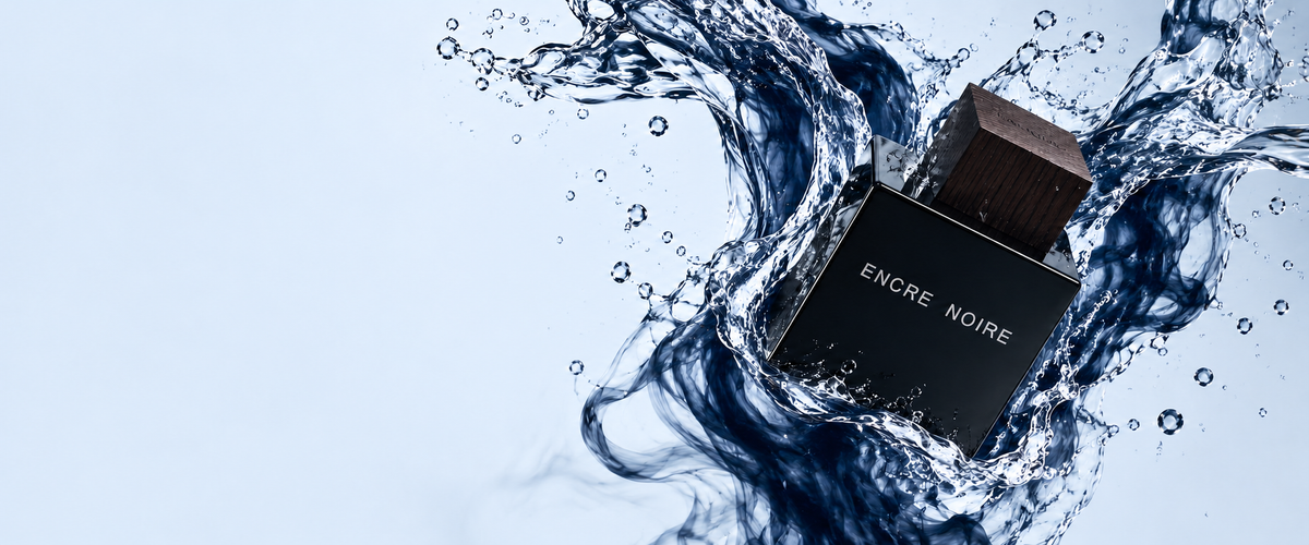 Lalique Encre Noire Eau de Toilette in a sculptural blue water splash