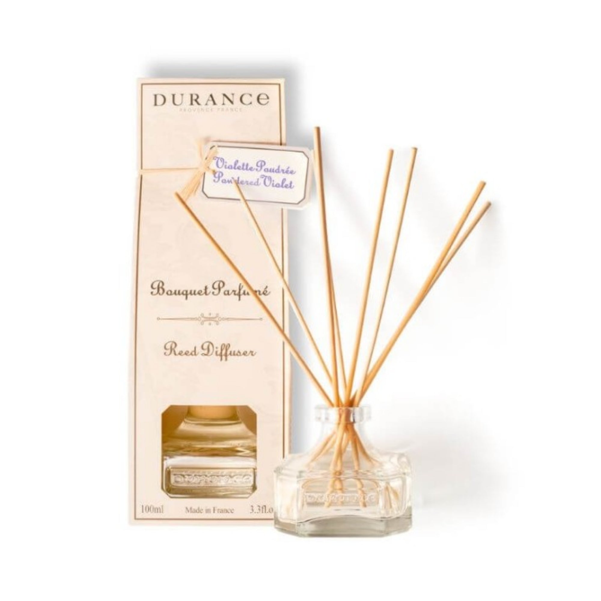 Reed diffuser with packaging on a white background